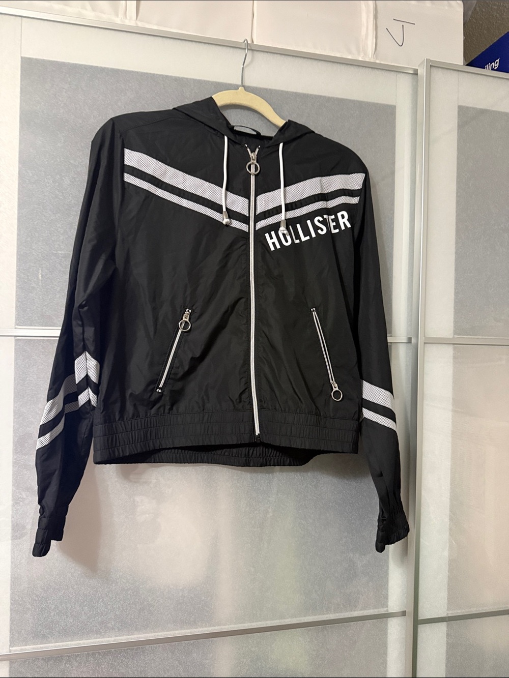 Hollister Black Hooded Windbreaker with White Stripe Accents